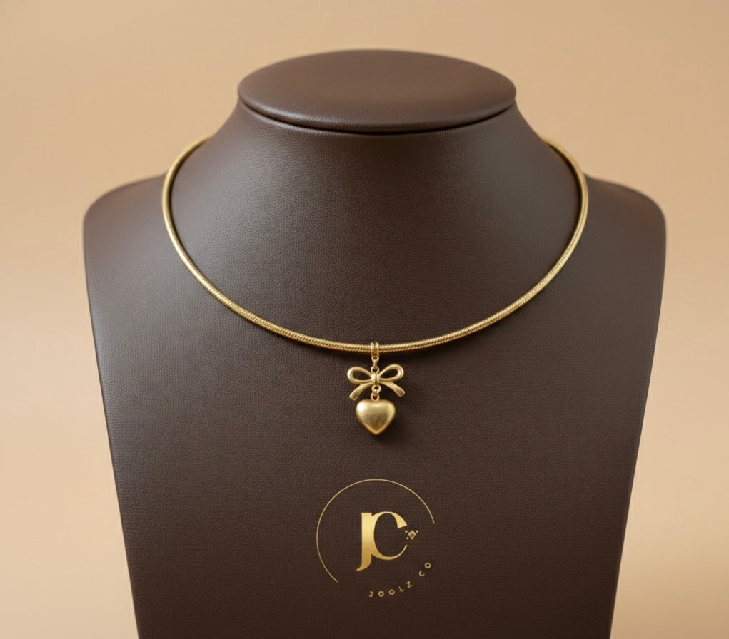 The "Coquette" Gold Torque Choker – Bow & Heart Edition