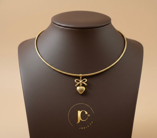 The "Coquette" Gold Torque Choker – Bow & Heart Edition